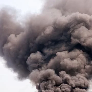 Thick dark smoke in a fire. Stock Photos