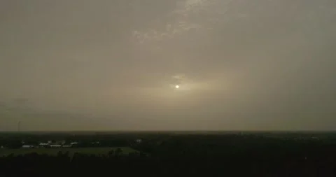 Thick dense Sahara dust cloud covering a sunset in Florida Stock Footage 133605754