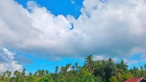 Thick Dramatic Clouds Over Countryside Village At Midday Stock Photos