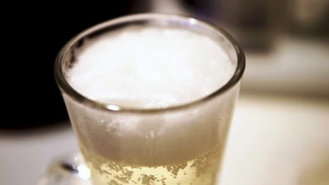 Thick foam in the glass and bubbles Stock Footage 106664889