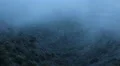 Thick fog covering mountains in darkness, mysterious atmosphere, horror film HD Footage