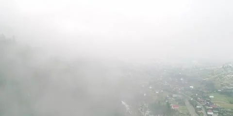 Thick fog in mountain, transparent cloud move under village Stock Footage 281643396