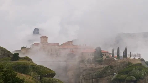 Thick Fog Rolling over Saint Stephen Monastery in Meteora Greece Video stock 344190267