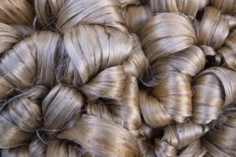 Thick Golden bundle of raw jute fiber Pattern Texture Stock Photos