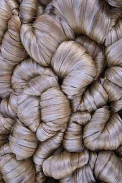 Thick Golden bundle of raw jute fiber Pattern Texture Can be used as a Back.. Stock Photos