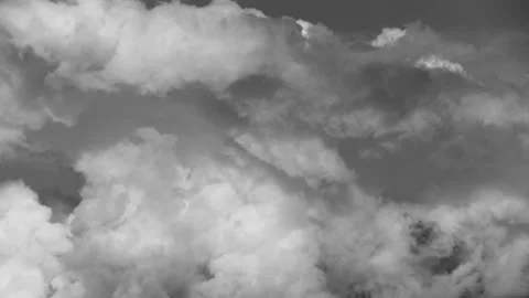 Thick gray clouds float dramatically across the sky. Time laps. Stock Footage 142078663