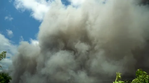 Thick Gray Smoke and Ash Rising Into the Sky From a Large Fire 스톡 동영상 343894638
