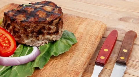 Thick hot beef meat hamburger lunch on wood Stock Footage