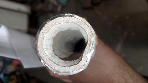 Thick Layer of Limestone Inside a Pipe Observed From a Top-Down Angle in an.. Stock Photos