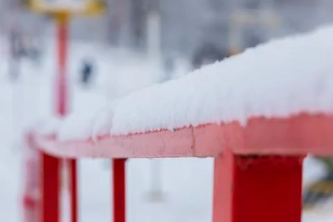 A thick layer of snow poured on the railing Stock Photos