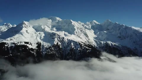 Thick layers of snow covering summits in Alpes-Belledonne, France Stock Footage 301370810
