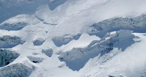 Thick layers of snow on mountain slopes. Tuyuk-su glacier. Stock Footage 145250752
