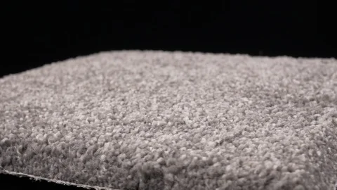 Thick light gray carpet rotating medium closeup 4k Stock Footage 108009744