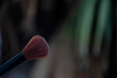 Thick make-up brush used as an applicator to blend, apply, and finish beautif Stock Photos