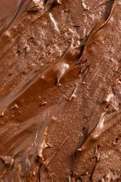 Thick melted chocolate spread surface abstract macro background Stock Photos