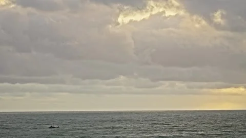 Thick Orange Clouds Glowing in Warm Tropical Sunset Sky Video stock 296570553