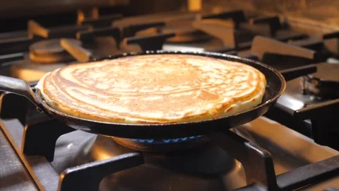 Thick pancake frying on a pan. Stock Footage 150431987
