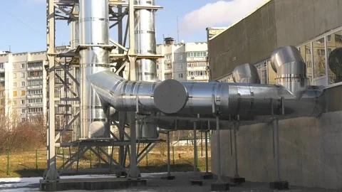 Thick pipes extending from a mini-boiler room Stock Footage 318822527