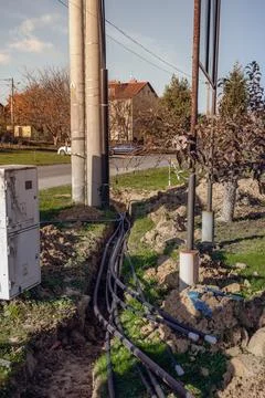 Thick power cable in the ground - electrical tunnel at the high voltage pole Stock Photos