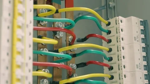 Thick power wires connect electrical devices and a large, powerful on-off switch Stock Footage 333364393