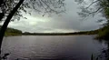 Thick rainy clouds over a lake in a nature reserve HD Footage