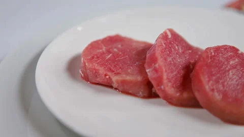 Thick Raw Steak Beef Close Up, Rotating Plate 動画素材 130401225