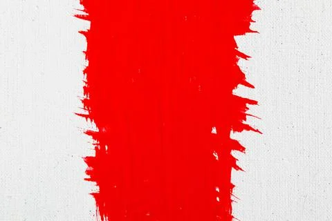 Thick red acrylic paint applied in an uneven patch on a flat surface Stock Photos