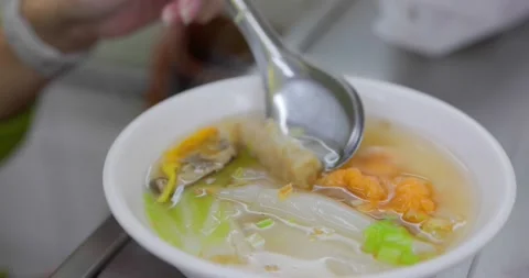 Thick rice noodles Ding Bian Cuo famous Keelung night market food Stock Footage 236459747
