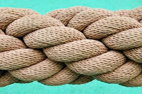 Thick rope on blue background Stock Photos