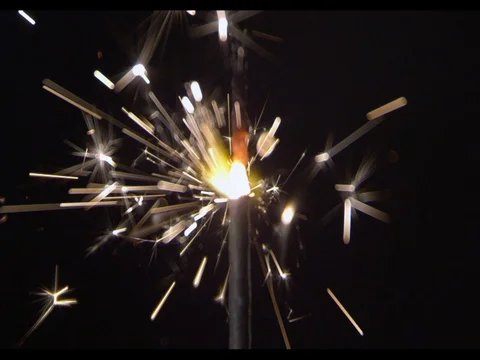 A thick short sparkler, Burning fire, close-up, camera moving along, slow motion Stock Footage 74306833