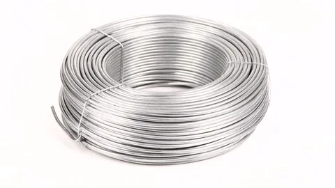Thick silver wire in coil. Stainless steel wire coil. Loop motion. Stock Footage 157769388