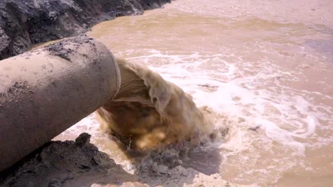 Thick Slurry Flowing From Industrial Pipe During Mineral Processing and Slu.. Stock Footage 339147560