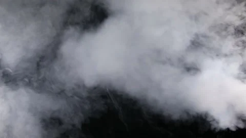 Thick smoke on black background Stock Footage 186748209