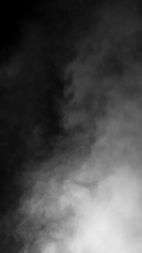 Thick smoke blast enters from corner on black screen, vertical format Stock Footage 340130836