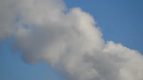 Thick smoke from a chimney - blue sky, time lapse - abstract background Stock Footage 146812635