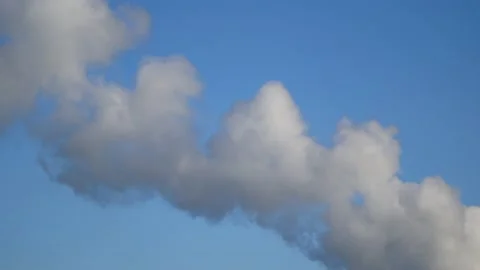 Thick smoke from a chimney - blue sky, time lapse - abstract background Stock Footage 146827414