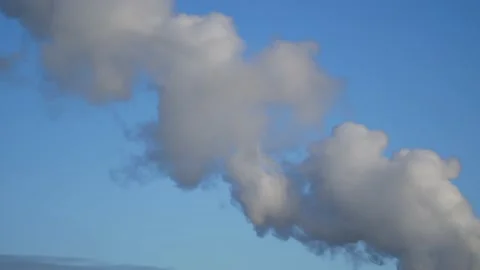 Thick smoke from a chimney - blue sky, time lapse - abstract background Stock Footage 146829948