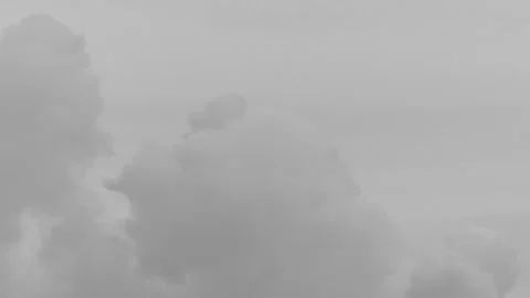 Thick smoke from a chimney in the sky in time lapse - monochrome background Stock Footage 145200110
