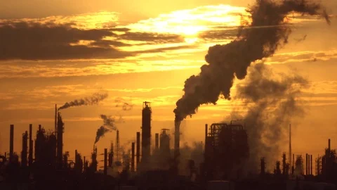 Thick smoke clouds spreading in air and covering golden sky Stock-Footage 115847885