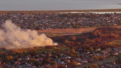 Thick Smoke Column Rises From Burned Grassland Beside Suburban Homes Aerial 動画素材 341840425
