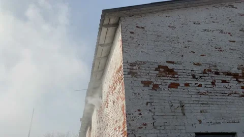 Thick smoke coming from the window of an old abandoned building Stock Footage