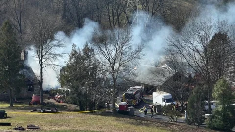 Thick smoke rising into sky after firemen at firefighting operations. Stock Footage 265136645