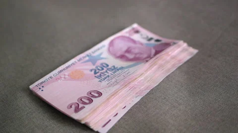 A thick stack of Turkish lira banknotes with a face value of two hundred lira is Stock Footage 222450977