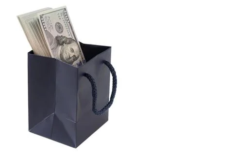 Thick stack of US one hundred dollar bills inside a small dark blue paper s.. Stock Photos