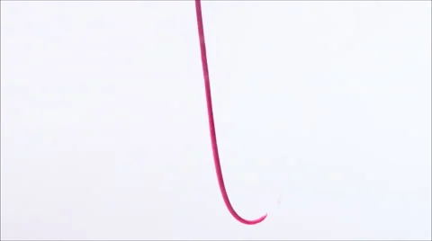 Thick strand of pink liquid descends over white, pluming into clouds Stock Footage 63860953