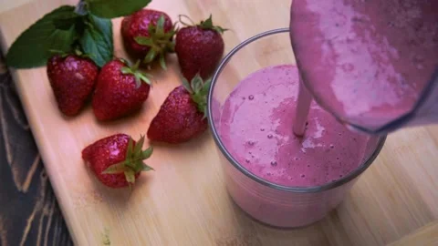 Thick strawberry smoothie Stock Footage 242104934