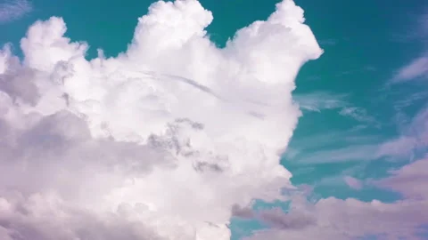 A thick white cloud swirls slowly in the azure sky. Beautiful landscape. Stock-Footage 142080933