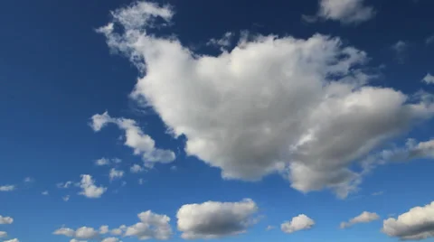 Thick white clouds in the blue sky time lapse Stock Footage 39633234