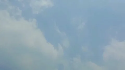 Thick white clouds flying fast across the clear blue sky. Clear sky during .. Stock Footage 292739165