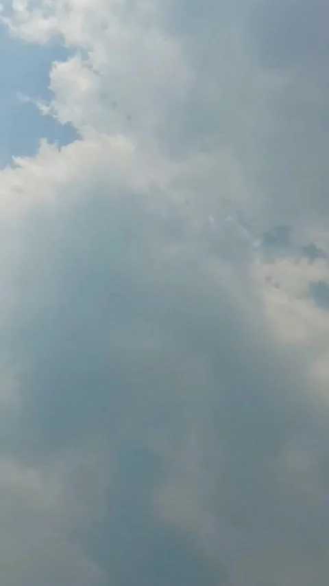 Thick white clouds flying fast across the clear blue sky. Clear sky during .. Stock Footage 292739276